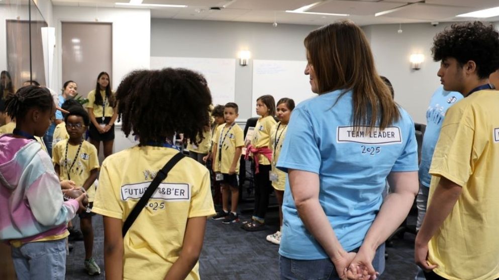 S&B Kids standing together as they prepare for a STEM activity at S&B's first Bring Your Kids to Work Day event.