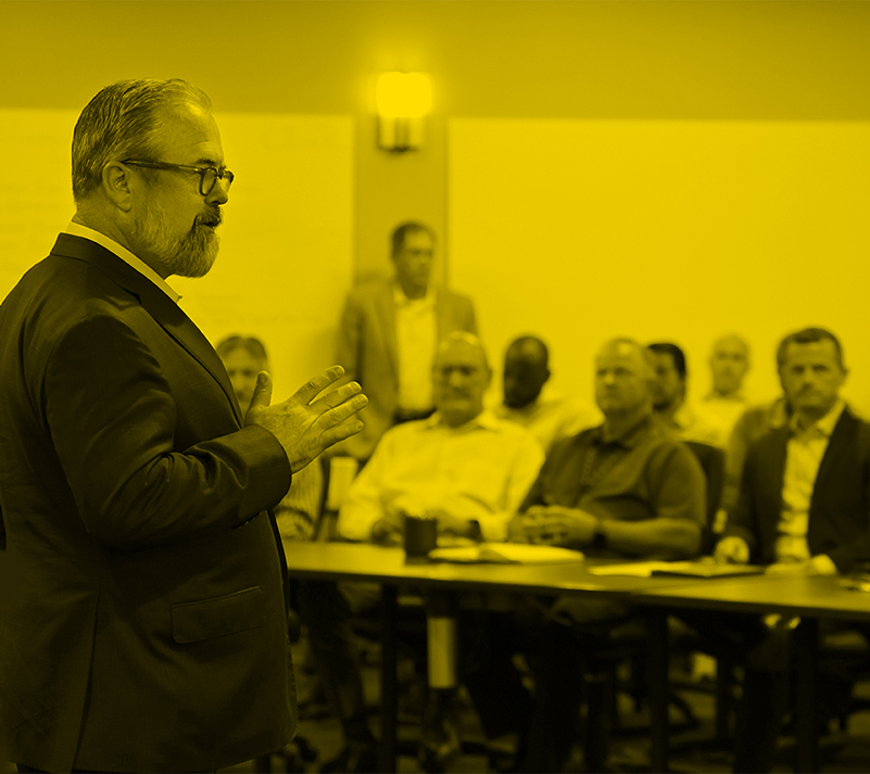 Jeff Sipes adressing the audience at a town-hall meeting