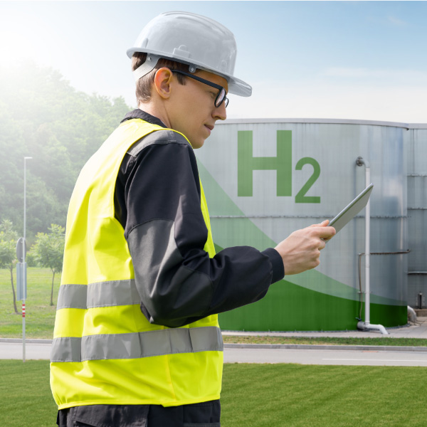 Engineer holding a tablet; green hydrogen